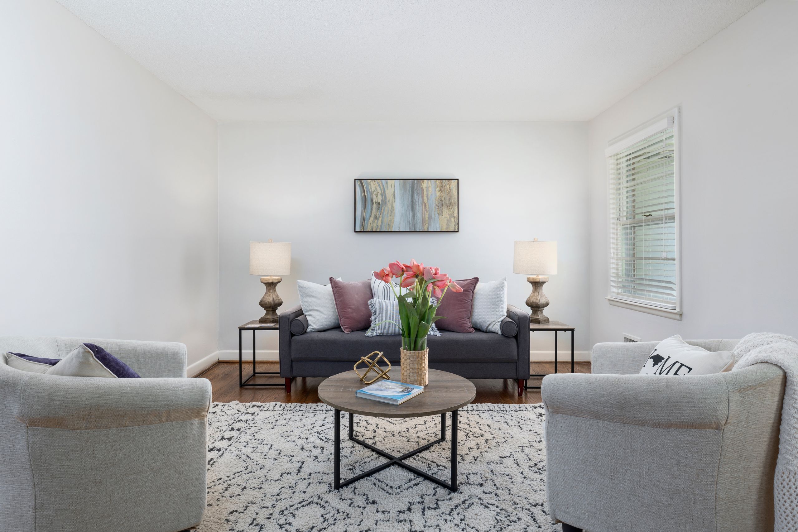 Bright and airy living room featuring a modern design with stylish furnishings and decor.
