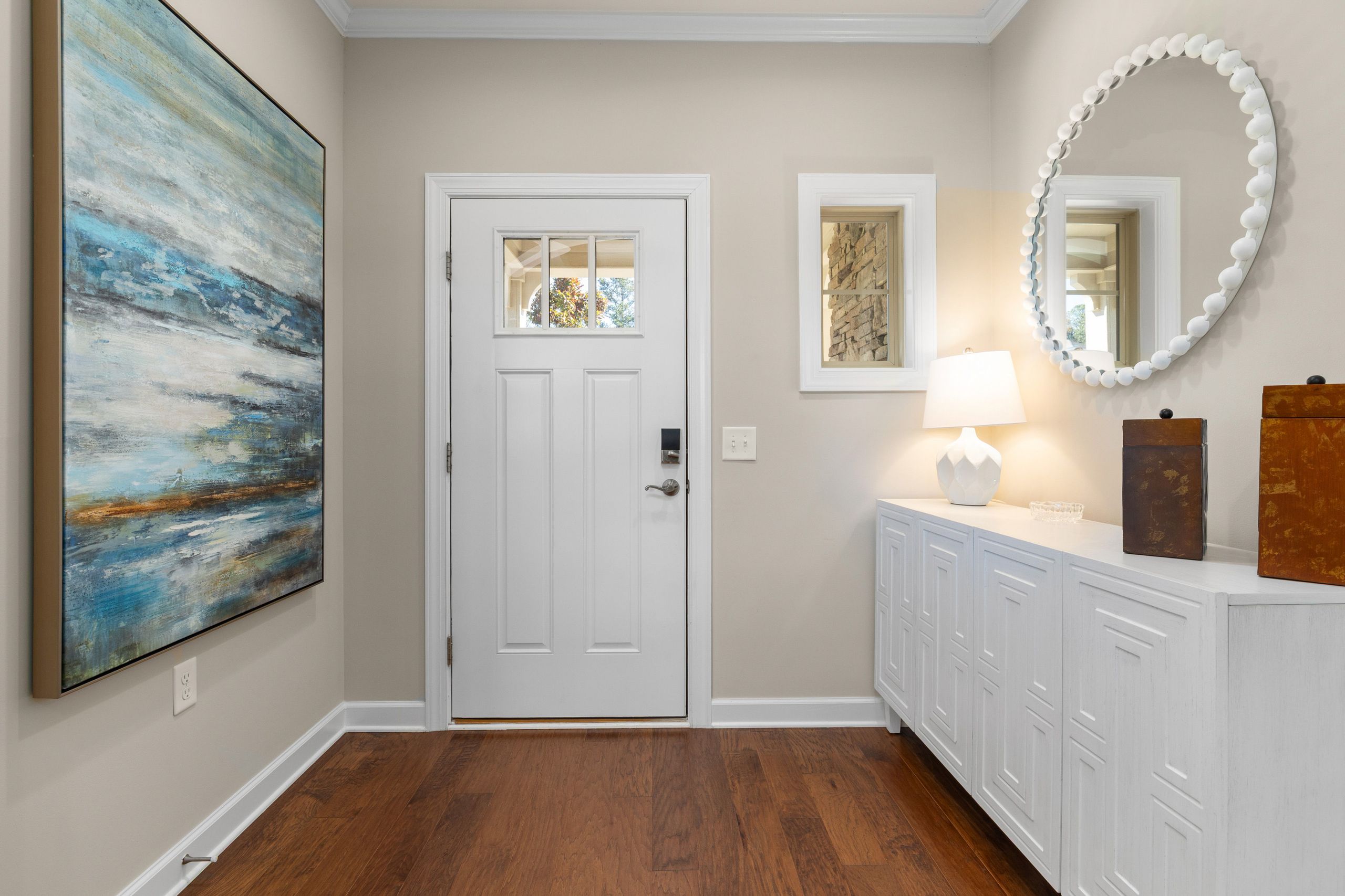Bright modern model home entryway prepared for buyer visits
