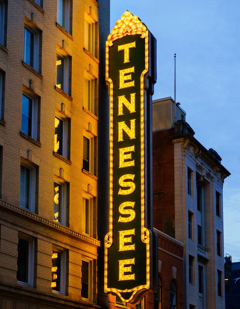 Illuminated Tennessee Theatre sign in Knoxville, Tennessee, showcasing vibrant architecture and city charm.